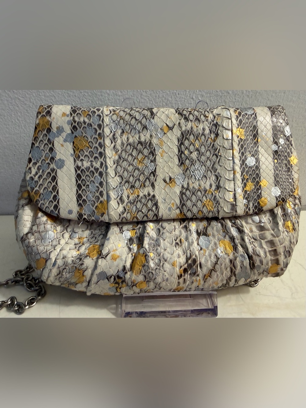 Inge Christopher metallic snakeskin clutch